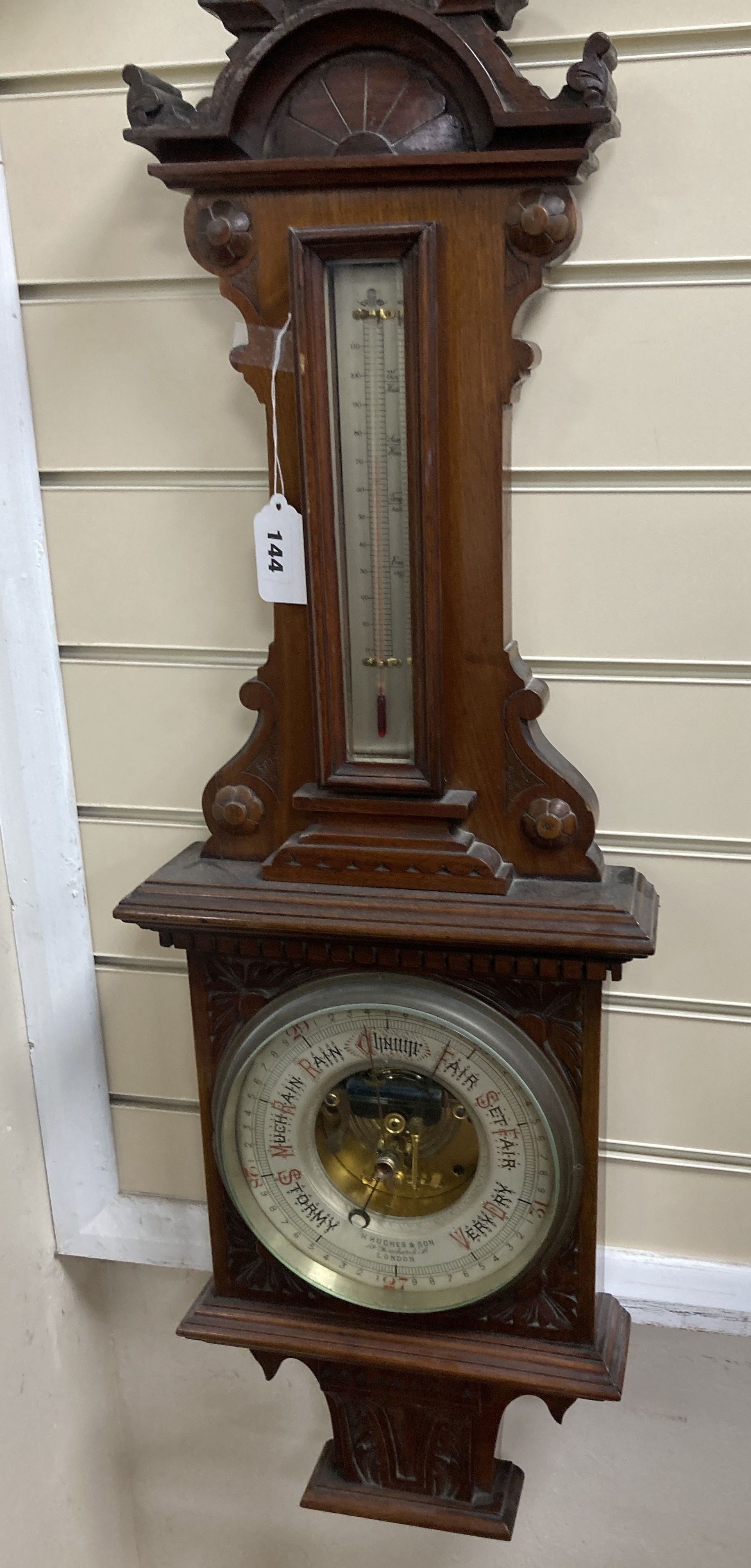 A Victorian carved mahogany wall hanging barometer, the silvered dial marked H. Hughes & Sons, 59 Fenchurch Street, London, height 92cm